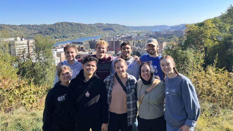 Students posing in group shot on justice trip.