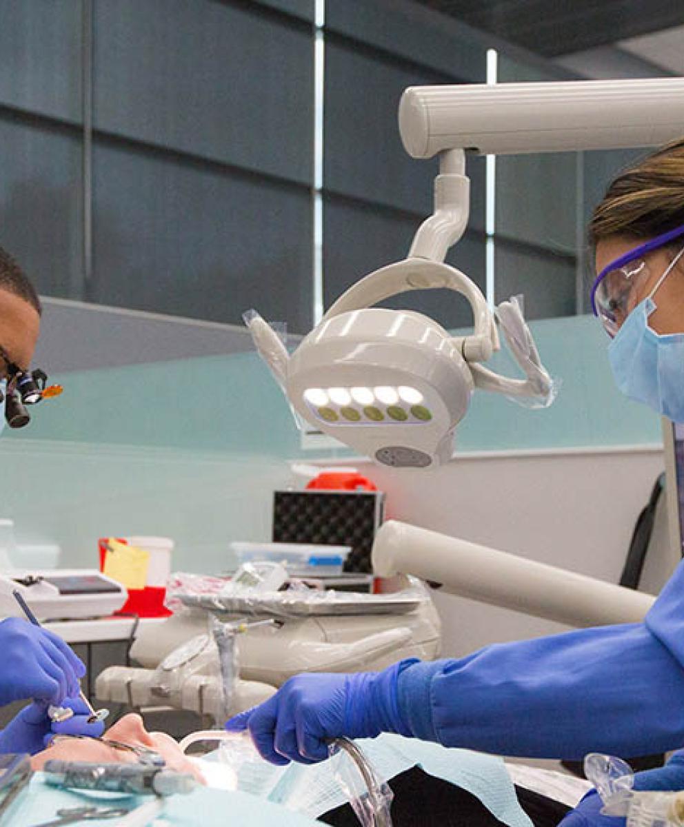 Creighton dental students practicing their craft.