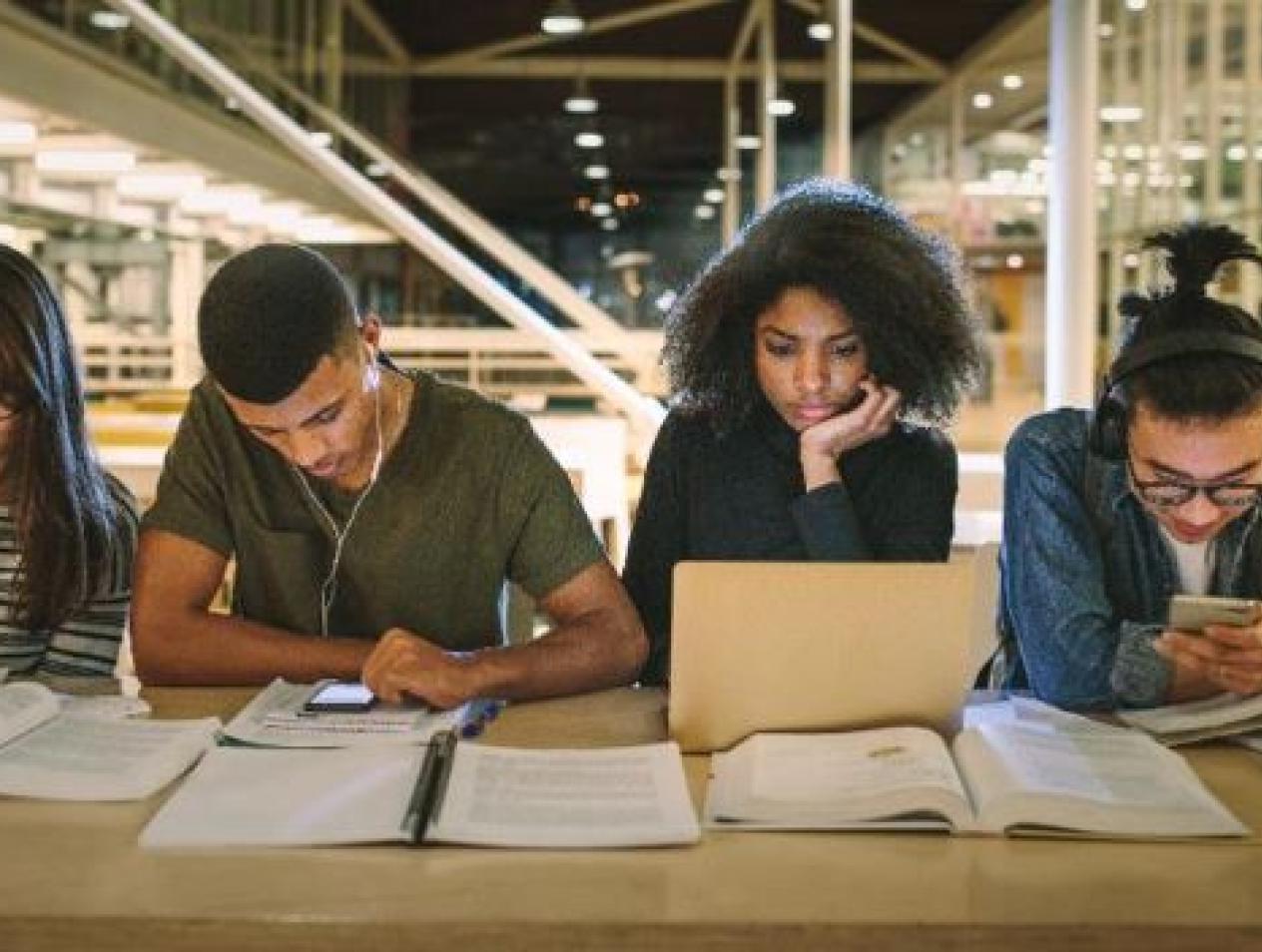 TRiO students studying at table