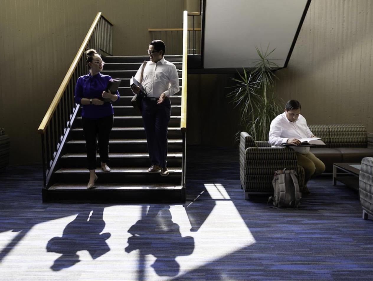 Law students walking down staircase