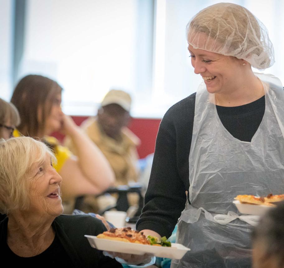 Volunteer serving meals