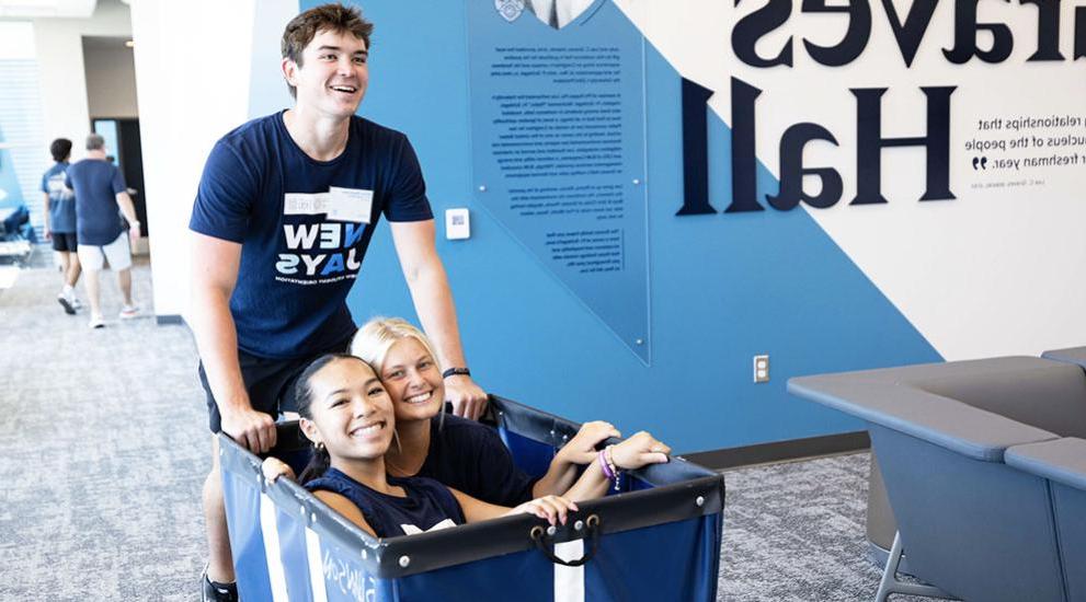 Move in students sitting in cart